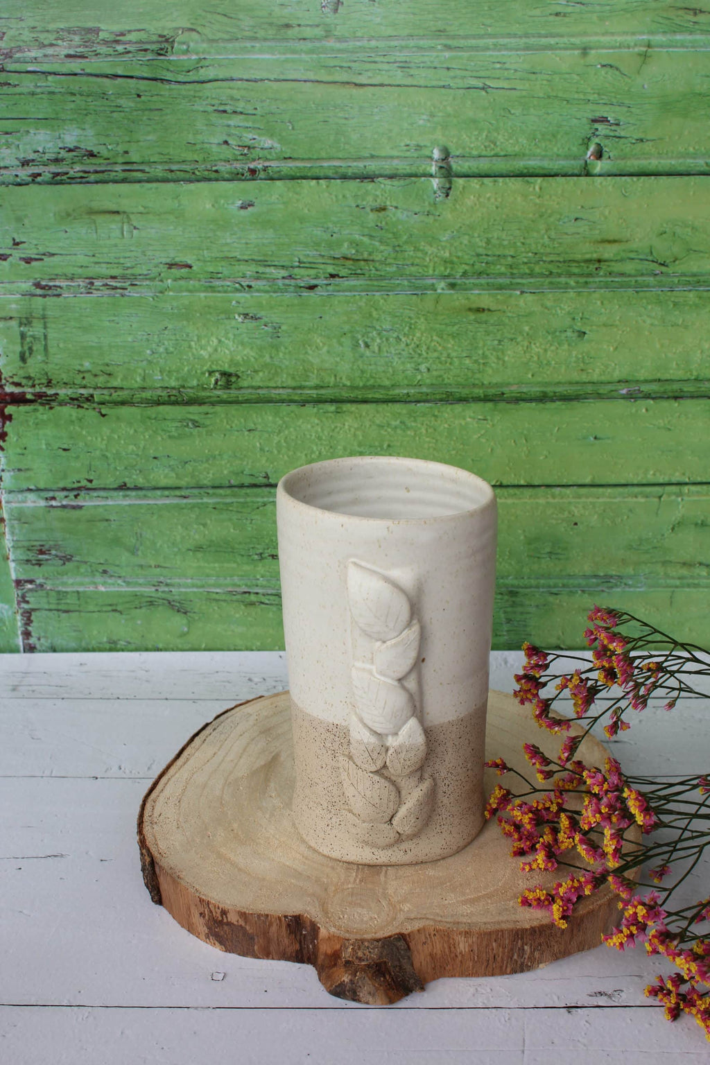 Le vase et son feuillage