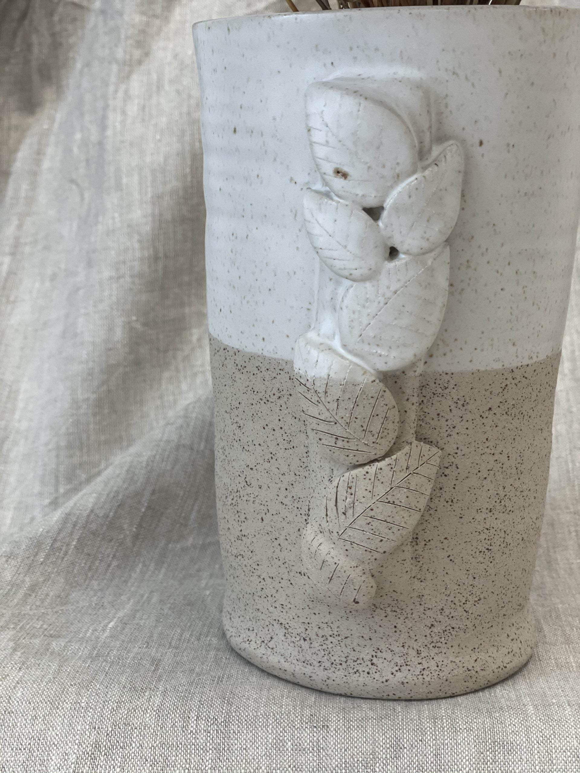 Le vase et son feuillage