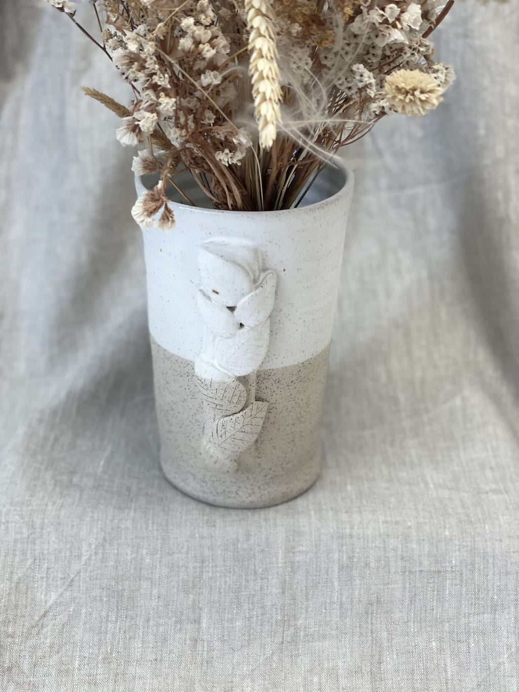 Le vase et son feuillage