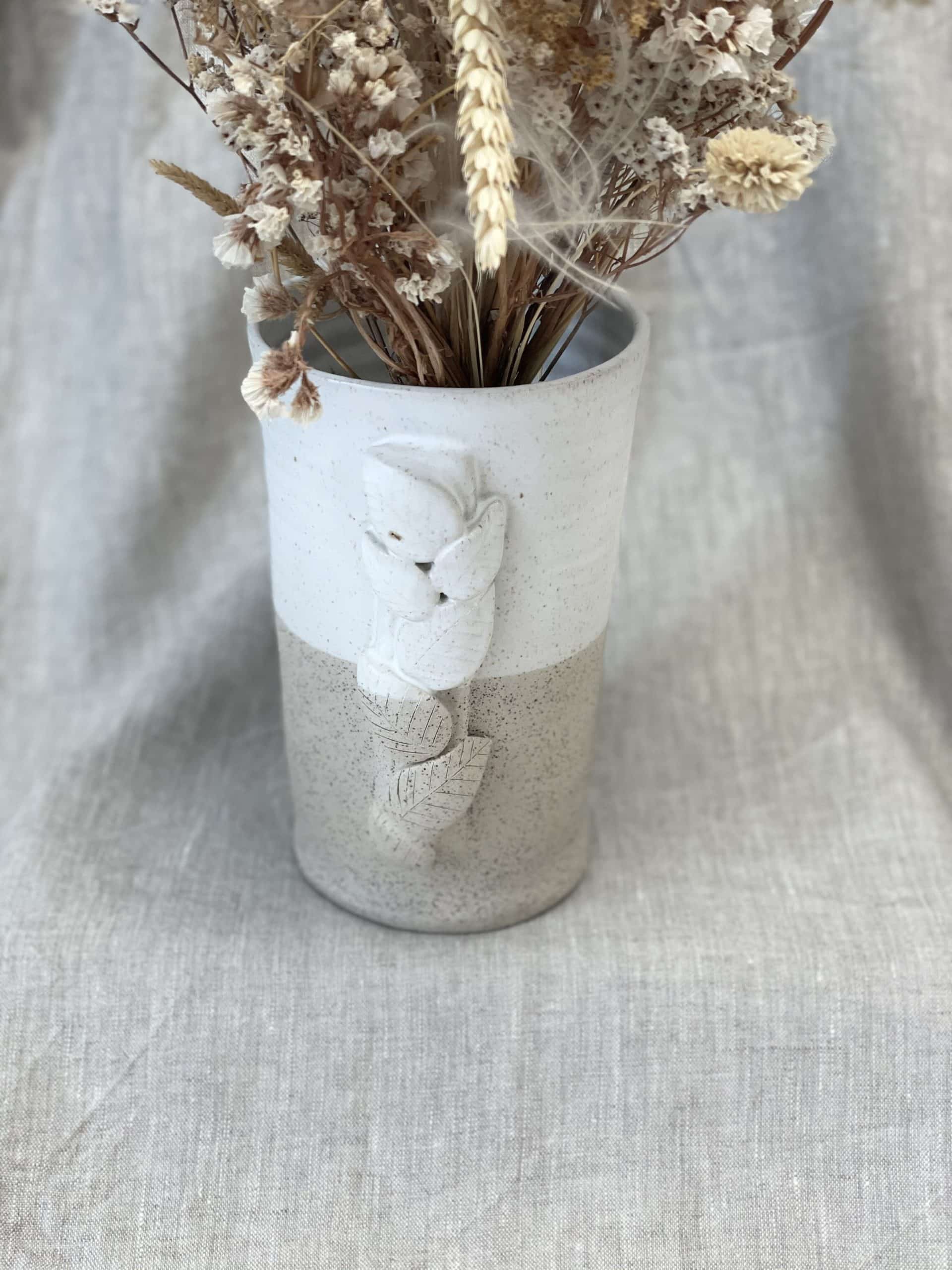 Le vase et son feuillage